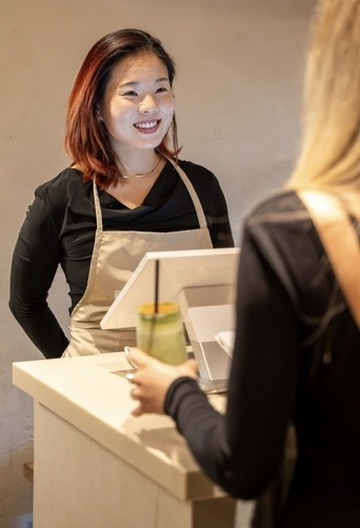 Filtrd barista pouring coffee